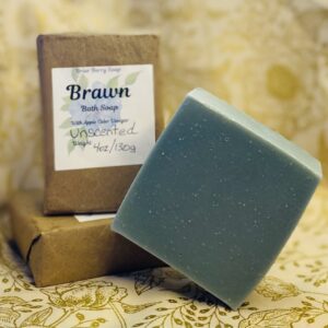 Three bars of Brawn soap stacked with one unwrapped and standing on its corner.