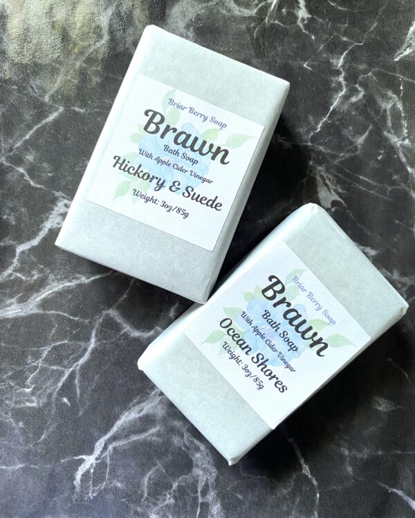 2 bars of Brawn soap on black and white marble background