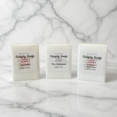 Three white bars of Simply Soap with Vitamin E by Briar Berry Soap in Lavender, The Gentleman, and Eucalyptus & Peppermint scents